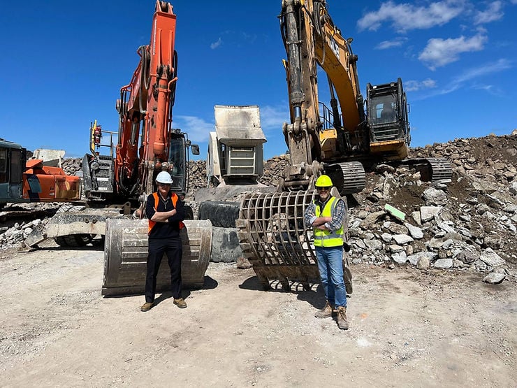 Aussie Buckets attachments with two people in front